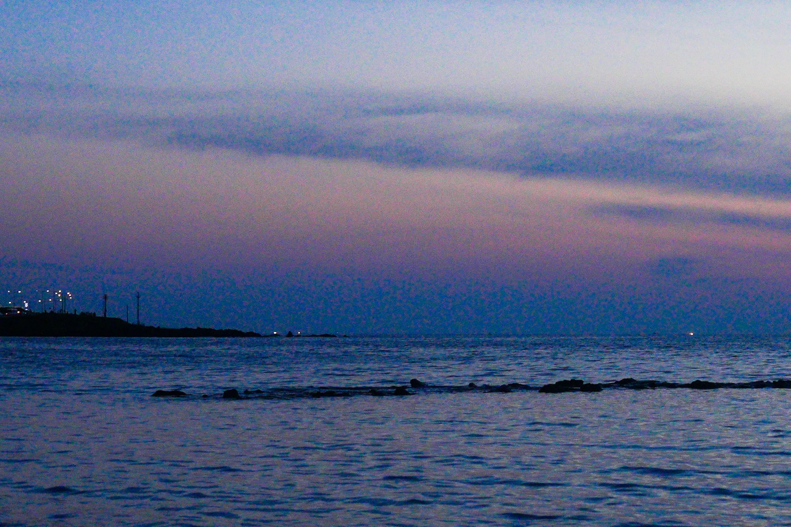 Jeju after sunset. Purple sky, calm water.