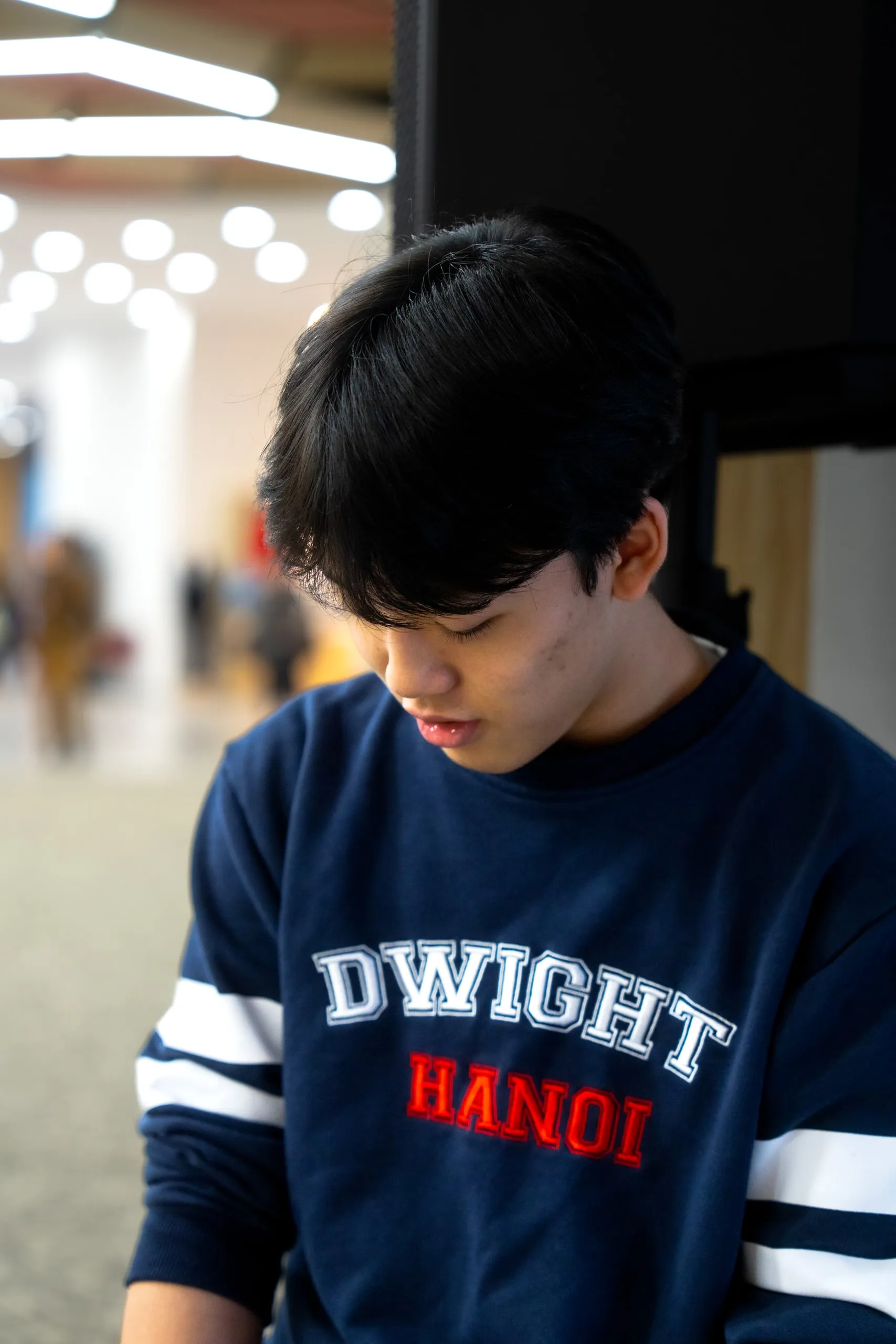 Head down in a Dwight Hanoi sweater.
