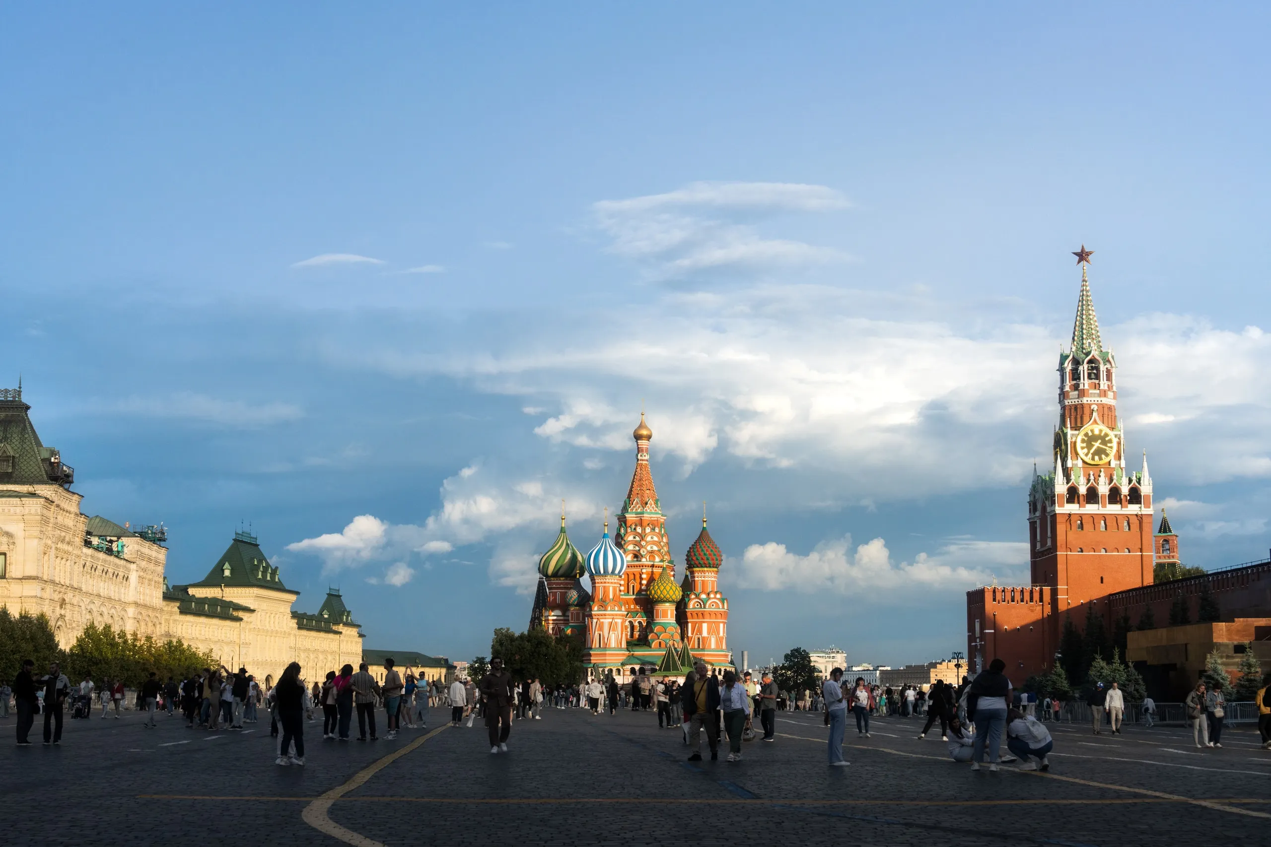 Red Square, Moscow. St Basil's in the middle, the Spasskaya Tower on the right. Crowds everywhere.