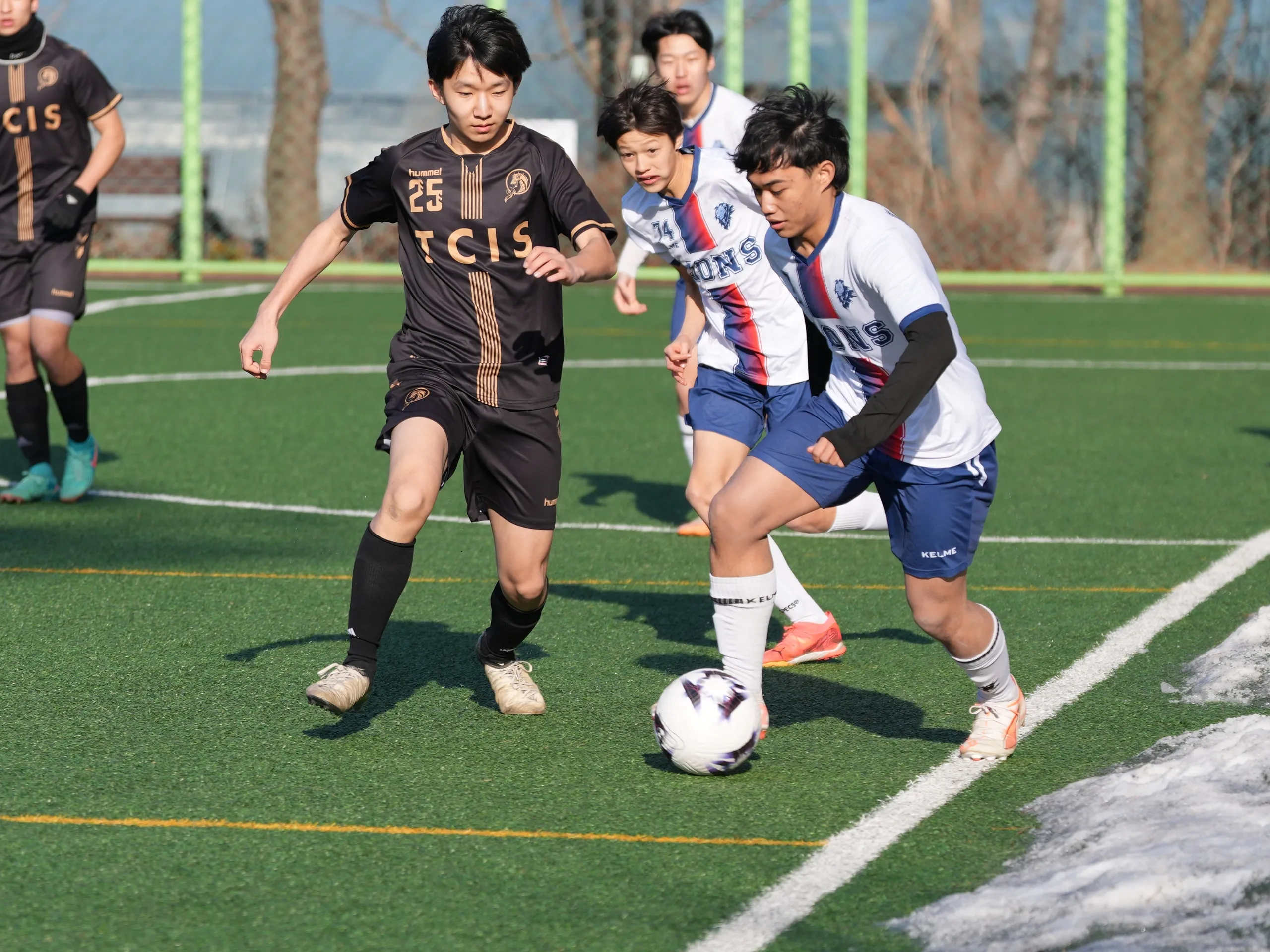 Varsity soccer, 2024 to 2025 season. Lions and TCIS fight for the ball.